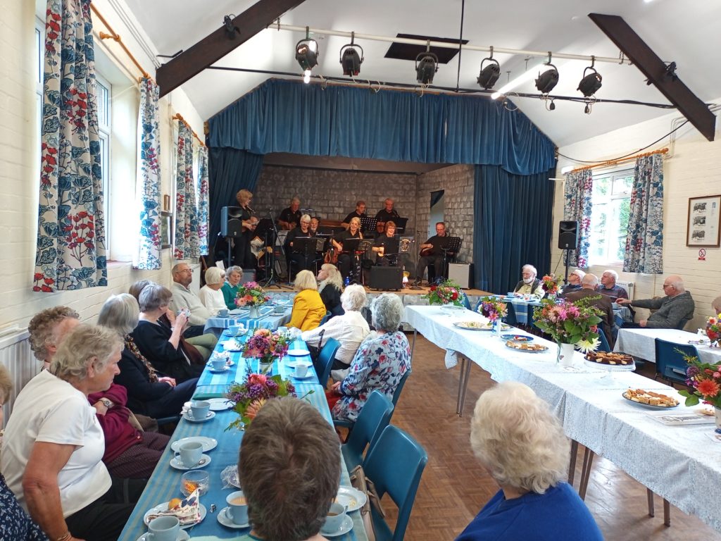 Tea at 2 event attendees enjoying tea for Theresa's CSR leave